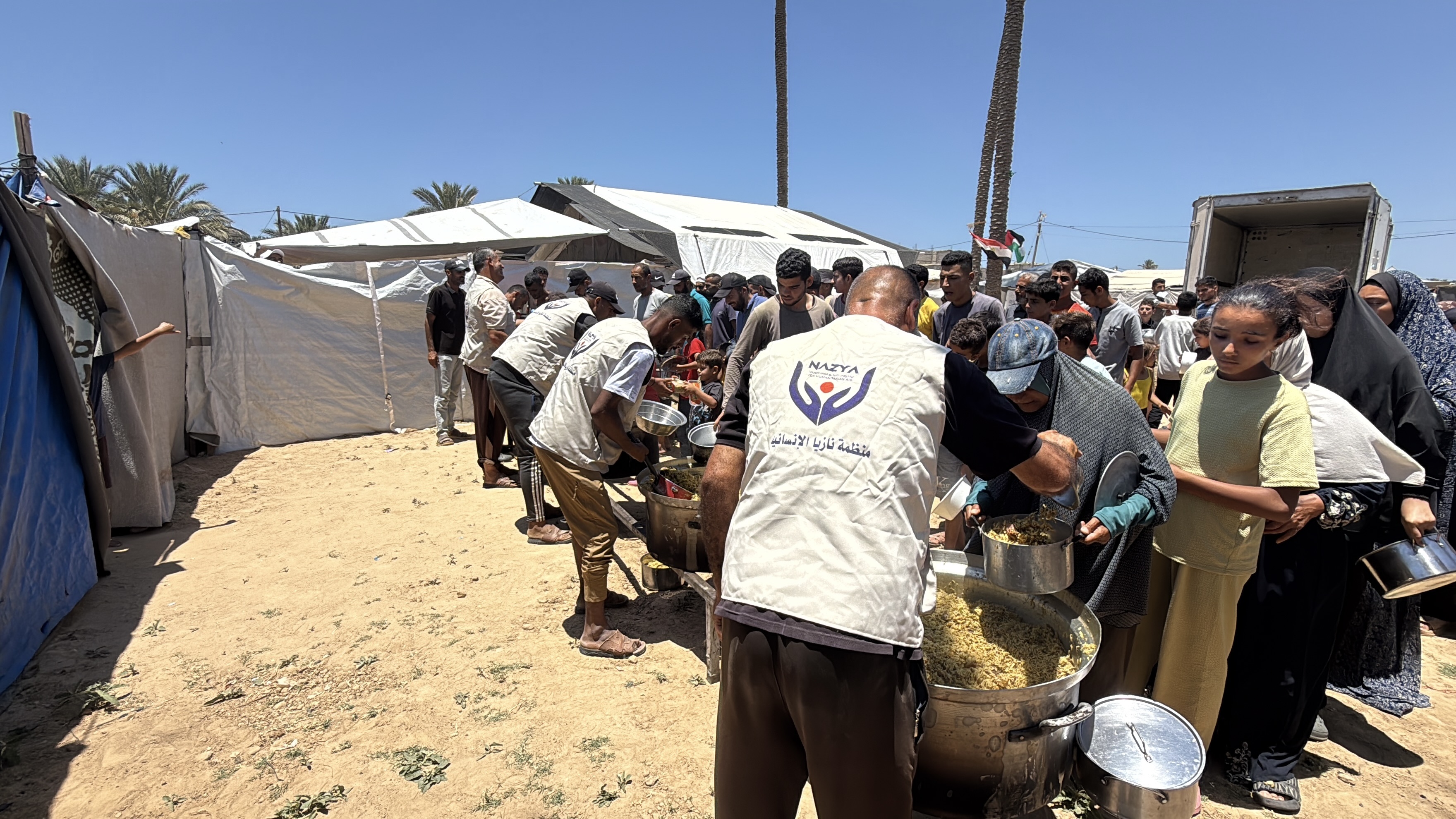 Nazya Humanitarian Aid food aid distribution for Palestinian families | delivering groceries, bread and essential food supplies to people in need in Palestine
